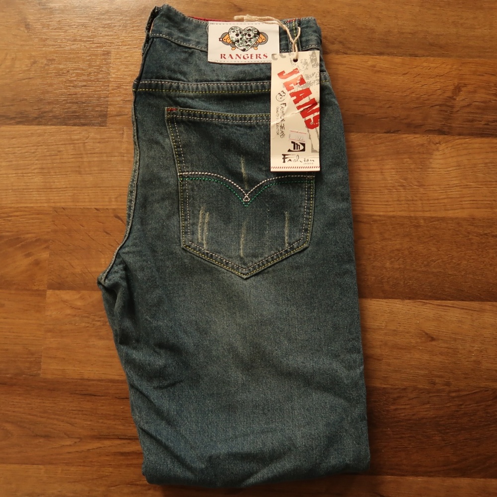 Mens size 33 demin jeans with designs.